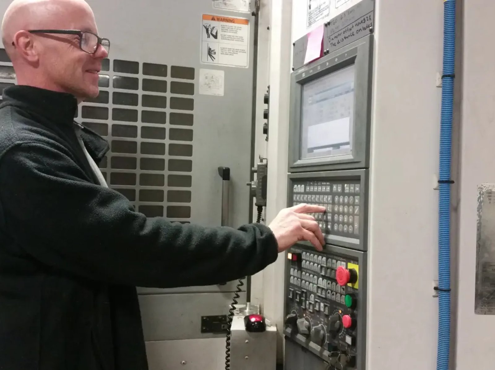 Photo of Electrician working on electrical panel with modern lighting and electrical work