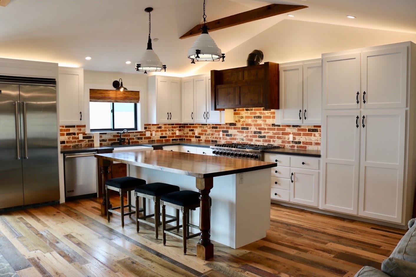 Pendant and recessed lighting in a finished kitchen