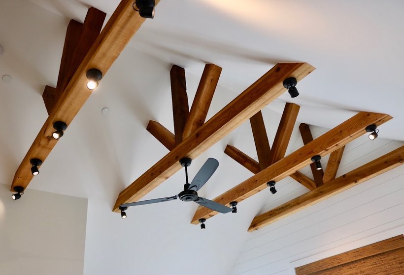 Interior lighting installed on exposed wood beams